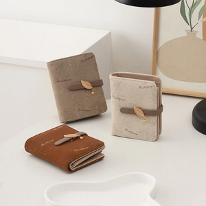 Short women's wallets with leaf texture print and delicate metal leaf pendants in three colors