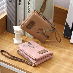 Short PU leather wallet for women with cute giraffe design and convenient wrist strap
