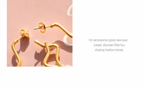 Macro shot of 18K gold plated stainless steel earrings with irregular wavy geometry