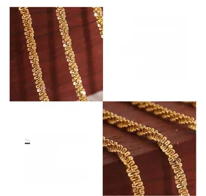 Detailed view of 18K gold plated titanium steel wavy chain with sparkling texture