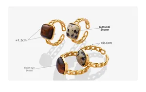 Detail view of curb chain rings with tiger eye and dalmatian jasper square stones