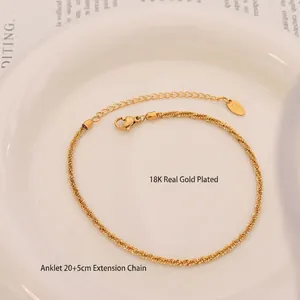 18K gold plated anklet with spiral texture and lobster clasp on white aesthetic plate