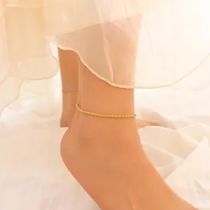 Minimalist 18K gold plated anklet with textured wave chain on female model