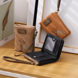Detailed view of women short PU leather wallets featuring giraffe illustration and wrist strap