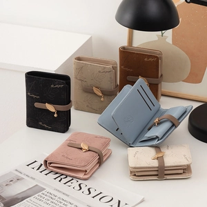Compact leaf buckle folded wallet for women in multiple colors with leaf pendant