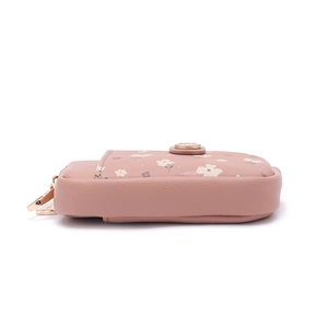 Detailed side view of floral mini wallet with golden metal hook and circular lock