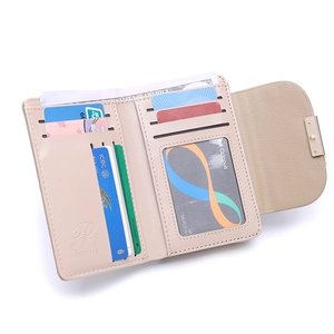 Interior layout of beige women's folding wallet showing multiple card slots and clear ID window