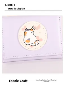 Close-up of lavender PU leather wallet featuring a cute cartoon cat fabric patch detail