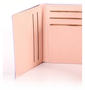 Detailed view of internal card slots and fine stitching on pastel women's slim wallet