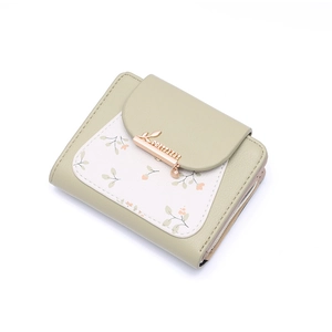 Close-up of a floral print green PU leather mini wallet with a gold leaf-shaped metal clasp