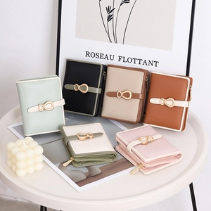 Detail of colorful cross-grain PU leather wallets with buckle and horseshoe metal hardware