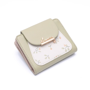 Close-up of light green PU leather wallet with floral print and rose gold logo snap