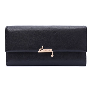 Detail of black pebbled leather long wallet featuring a gold heart-shaped pendant charm