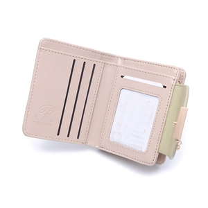 Interior detail of a compact women's faux leather wallet with card slots and photo window