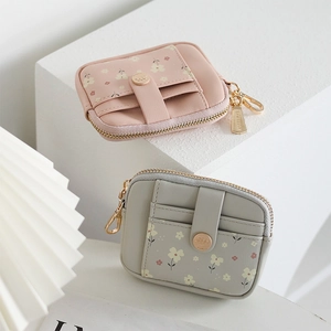 Floral short wallets in pink and grey featuring multiple card slots and gold zippers