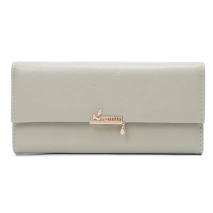 Close-up of minimalist long wallet with PRETTYZYS gold logo and leaf pendant detail