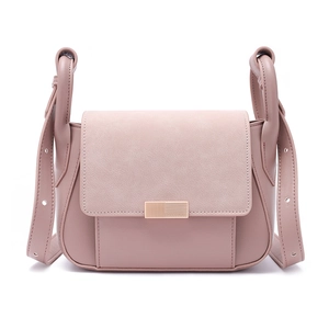 Detail of dusty rose shoulder bag with textured leather and gold-tone metal lock
