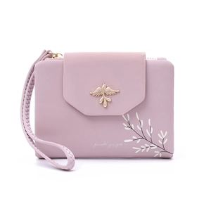 Detail of pink PU leather wallet with gold bird metal accent and leaf print design