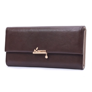 Detail of dark brown long wallet with litchi grain texture and gold metal logo buckle