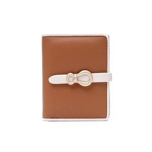 Detail of brown crosshatch leather wallet with white trim and gold horseshoe buckle