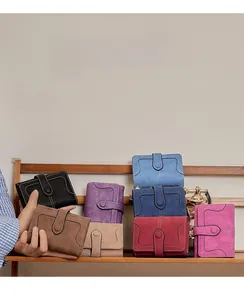 Detailed view of multi-color vintage bifold wallets with stitching and snap button closure