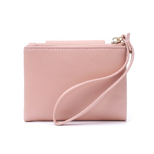 Detailed view of light pink synthetic leather wallet with gold zipper and wristlet strap