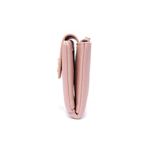 Side view of folded light pink PU leather wallet showing thickness and stitching