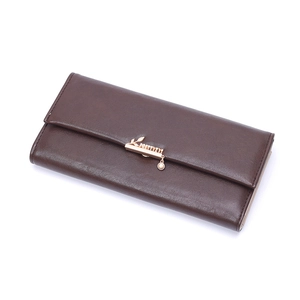 Detailed close-up of brown long wallet with golden leaf clasp and decorative bead