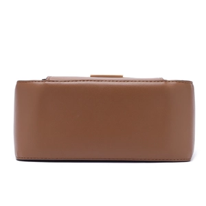 Detailed side and bottom view of brown leather bag with precise stitching and golden buckle