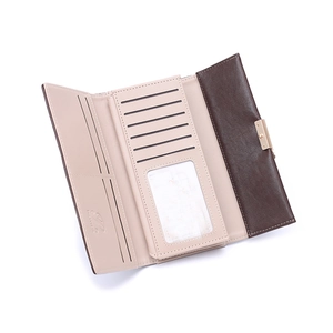 Internal detail of a tri-fold long wallet showing multiple card slots and ID window