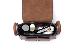 Top view of brown leather bag interior showing spacious capacity for daily essentials
