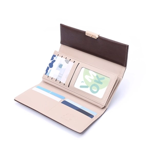 Close-up of long women's wallet showing multiple card slots and gold metal buckle detail