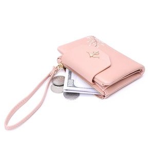 Short pink leather wallet for women with golden bird logo and floral patterns