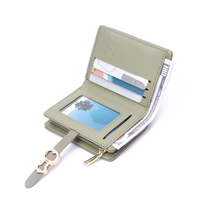 Green minimalist leather bifold wallet with rose gold hardware and multiple card slots