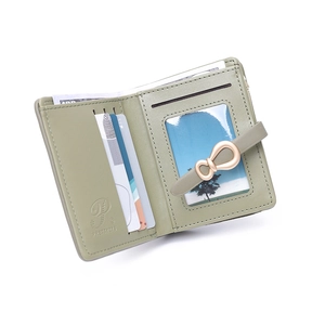 Macro view of mint green PU leather wallet interior with multi-card slots and bank notes