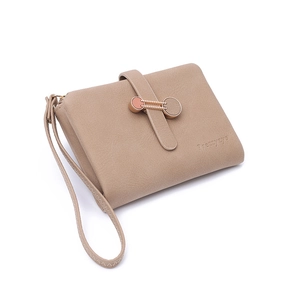 Detail of solid color handbag with metal double ring buckle and logo texture