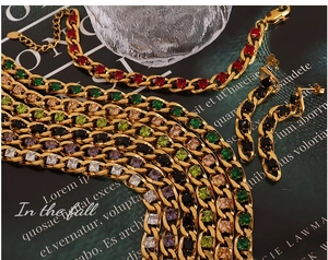 Macro detail of gold-plated chain set with vibrant multi-color square cubic zirconia crystals