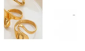 Detailed macro view of the gold wave ring with a polished liquid-style abstract finish