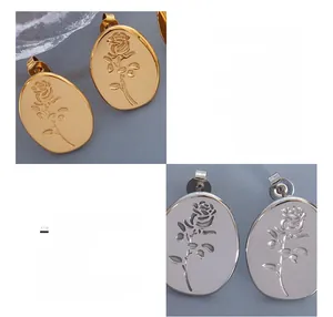 Detailed close-up of retro oval rose relief stud earrings in gold and silver finish