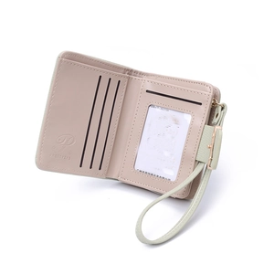 Close-up of pink short wallet interior showing card slots and clear ID window