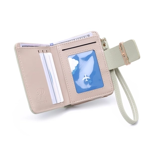 Interior view of mint green tri-fold wallet showing multiple card slots and ID window