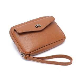 Brown leather passport wallet with PZ metal logo, main zipper, and wrist strap