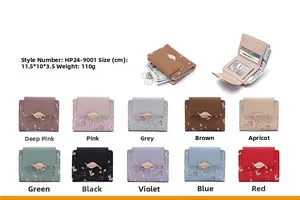 Detailed interior of women's floral tri-fold wallet with card slots and leaf buckle