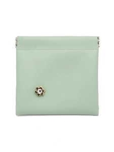 Detail view of mint green crocodile pattern coin purse with floral gold metal closure