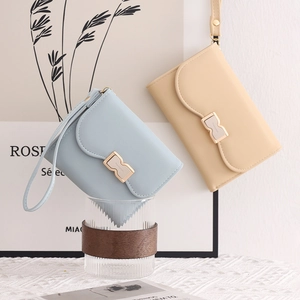 Elegant solid color sweet bow three-fold student wristlet wallet for women in soft blue