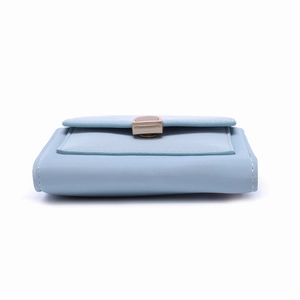 Close-up of light blue small trifold wallet featuring white stitching and gold metal clasp