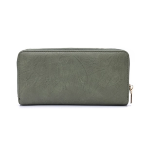 Close-up of a long zippered wallet in grey-green vintage leather texture with gold zipper
