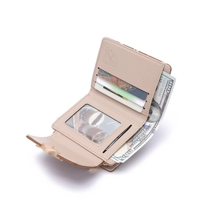 Detail view of pink trifold wallet interior with card slots and bill compartment