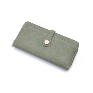 Detailed view of sage green long wallet with crinkled leather texture and metal clasp