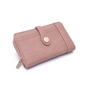 Close-up of dusty pink leather wallet with multi-card slots and golden hardware zip